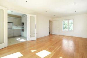 LIVING/DINING ROOM WITH BALCONY ACCESS- click for photo gallery